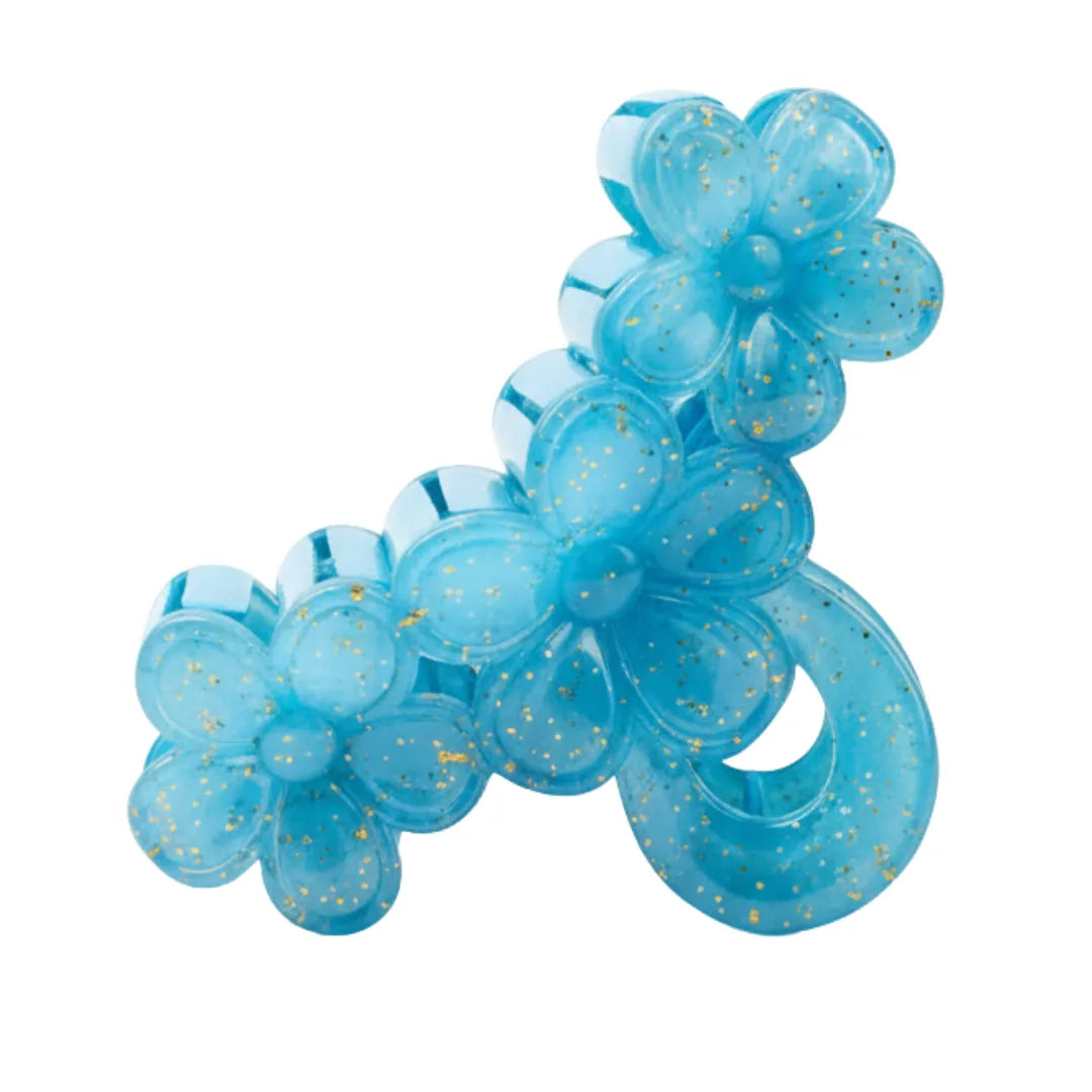 Side view of a 3D blue flower hair catcher showing the sturdy interlocking teeth and durable spring mechanism.