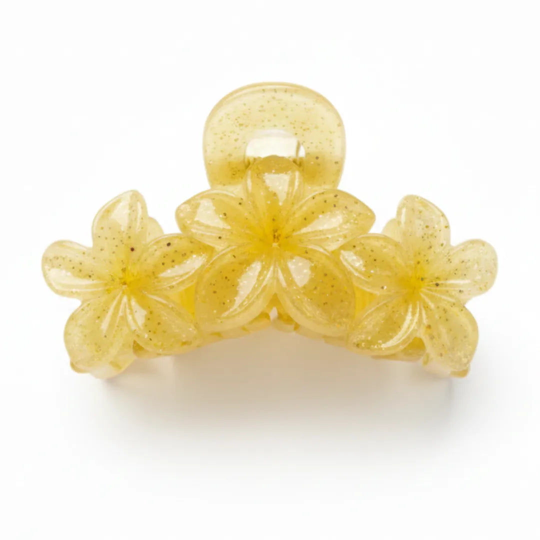 Side profile of a glitter flower hair catcher showing the sturdy interlocking teeth and high-tension spring.