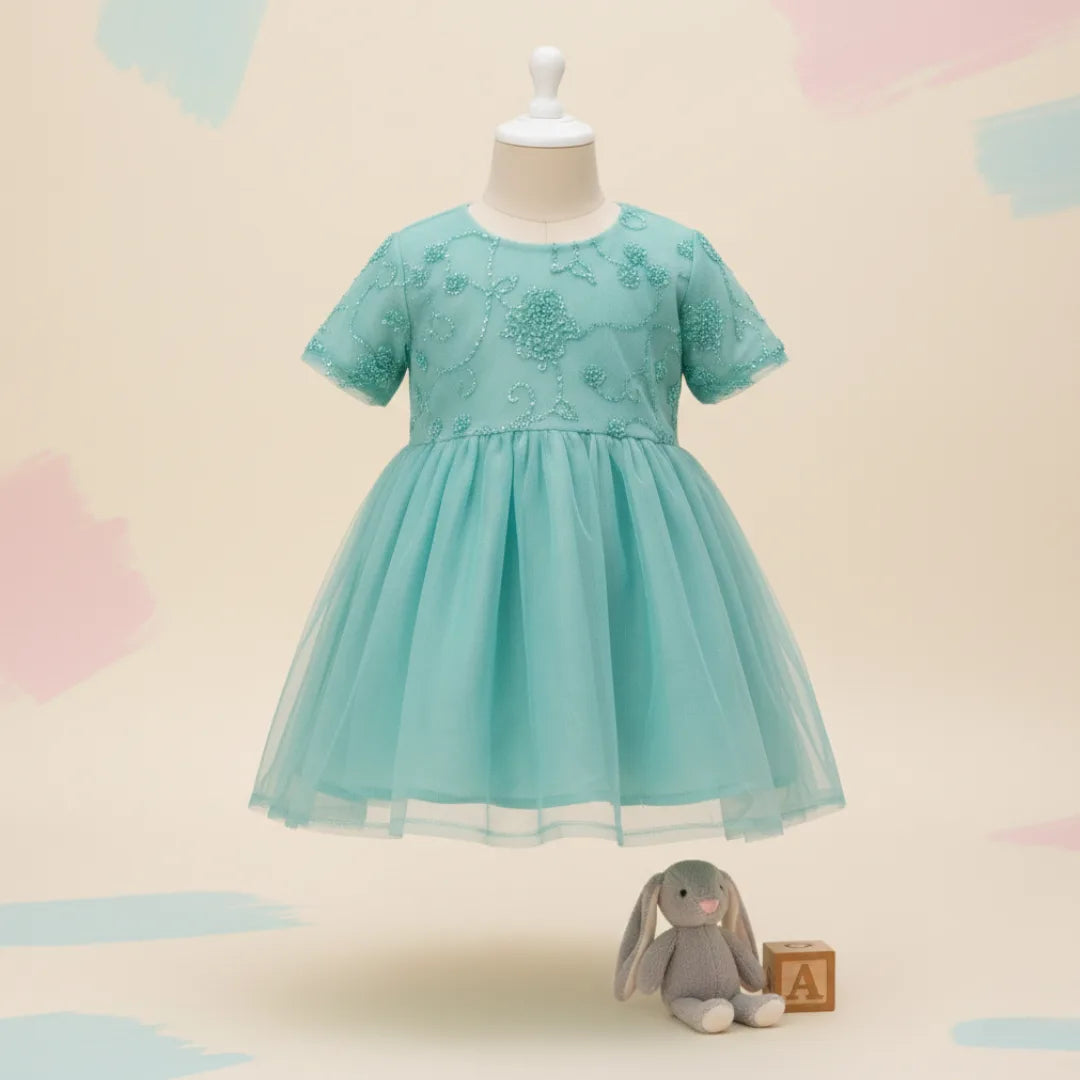 Full length view of toddler girl wearing sea green fancy net dress