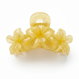 Side profile of a glitter flower hair catcher showing the sturdy interlocking teeth and high-tension spring.