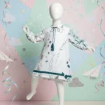 White teal botanical girls tunic with balloon sleeves – full body view