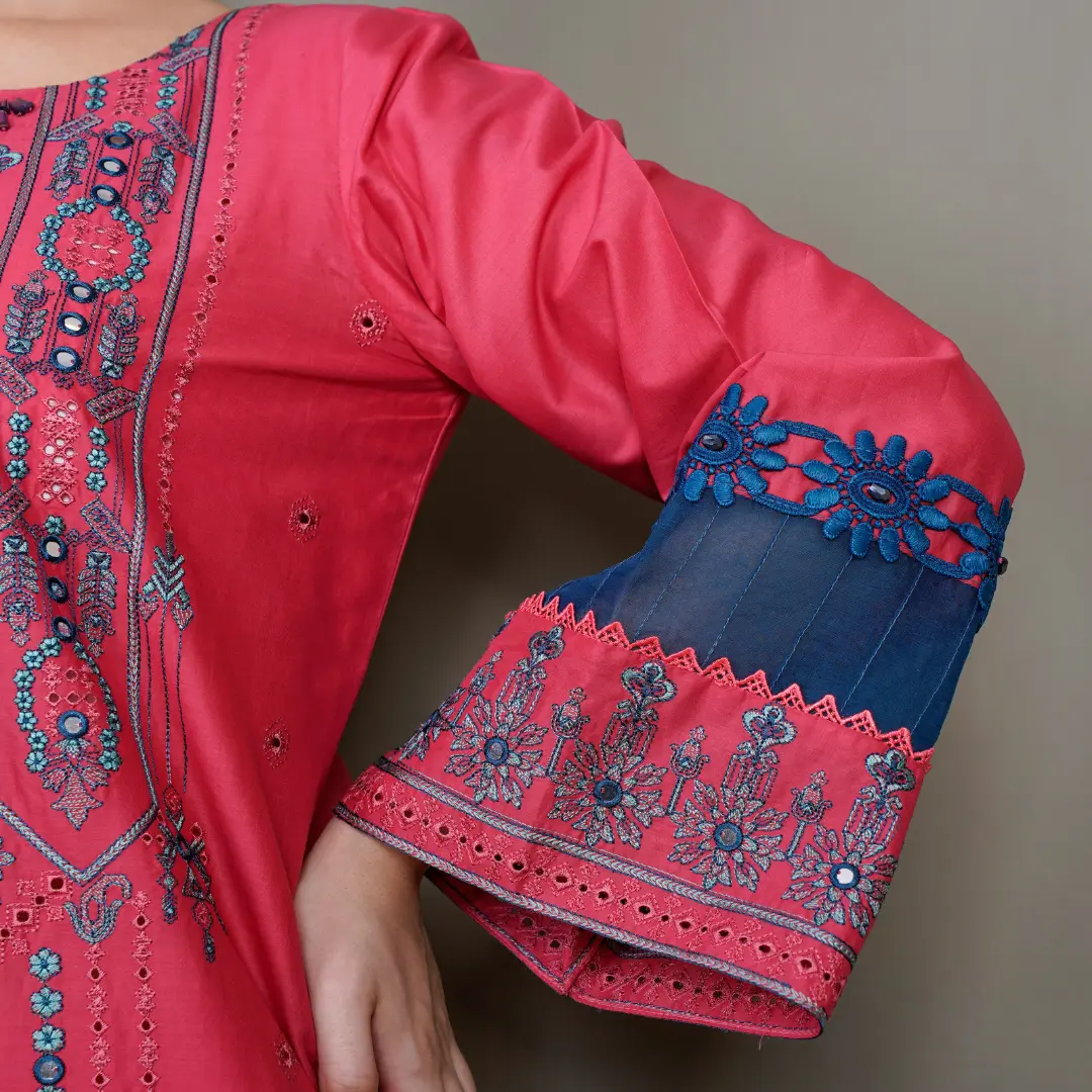 Woman wearing pink embroidered Pakistani kurta with blue bell sleeves and mirror work – women's clothing online Pakistan – Applique Threads
