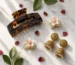 Hair accessories Pakistan – tortoiseshell claw clip, floral hair clips and gold jhumka earrings flat lay by Applique Threads